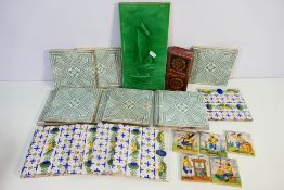 A collection of vintage ceramic tiles to include Delft examples,