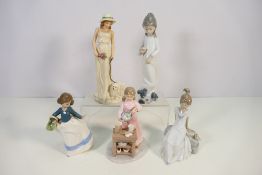 A collection of ceramic figures, three Nao and other, largest approximately 26 cm (h).