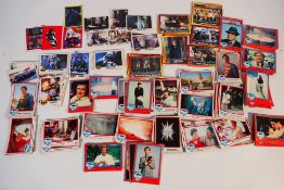 A collection of trade cards, Superman and Batman.