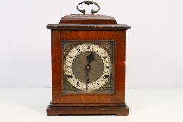 A mahogany cased bracket style clock by Perivale, with key and pendulum, 28 cm (h).