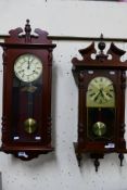 Two Vienna style wall clocks comprising a Hermle and Highlands, both with pendulums and key. [2].