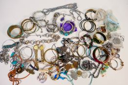 A collection of costume jewellery to include bracelets, necklaces, earrings and similar,