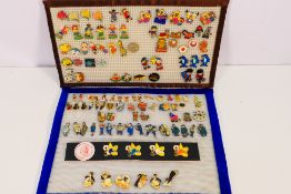 A collection of 100+ pin badges, Characters, charity & promotional, includes enameled examples,