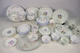 A collection of floral decorated tea wares comprising Royal Devon and Susie Cooper,