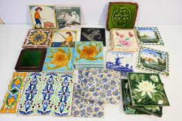 A collection of various vintage ceramic tiles to include Delft, floral decorated and similar.