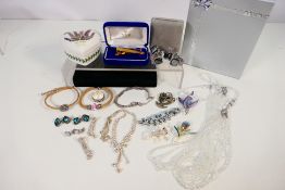 A collection of costume jewellery to include bracelets, earrings, brooches, ring and other,