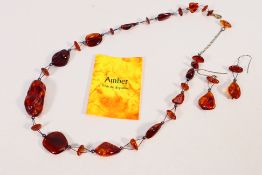 An amber necklace and earrings set, approximately 50 cm (l).