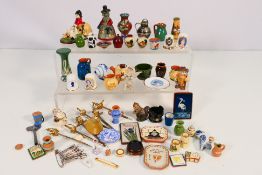 A small group of collectibles to include: A 9 carat gold pin (approximate weight 0.8 grams).