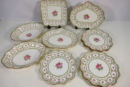 A collection of Royal Doulton plates and dishes decorated with pink flowers and foliate swags, Rd.