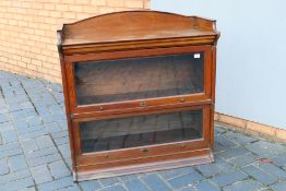 A two tier oak sectional bookcase, The Lebus Bookcase,