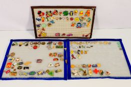 A collection of 100+ pin badges, mostly