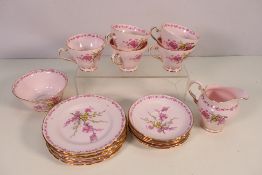 A quantity of Tuscan Fine English Bone China tea wares decorated in the April Beauty pattern with