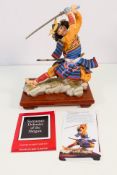 A Franklin Mint bisque porcelain figure, Samurai, designed by Sum Nakamura,