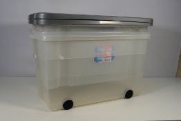 Plastic storage tubs x 3 - Two with lids and 1 with wheels but no lid. Used condition.