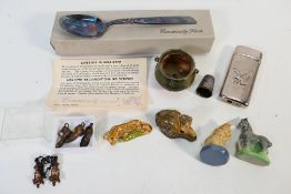 Lot to include a cigarette lighter, thimble, charms, small quantity of Wade and other.