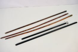 A collection of swagger sticks to include one with Cheshire Regiment crest.