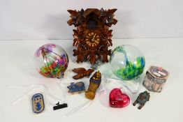 Lot to include a cuckoo clock, glass baubles and a quantity of Egyptian style ornaments.