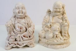 Two resin Buddha statues.
