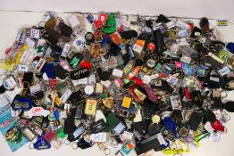 A very large quantity of keyrings, automotive related, advertising and other.