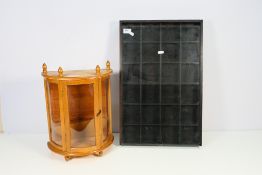A small demi-lune tabletop display cabinet, 39 cm x 30 cm x 15 cm and a storage / display box. [2].