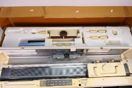 Knitting machines comprising an Empisal Knitmaster 580,