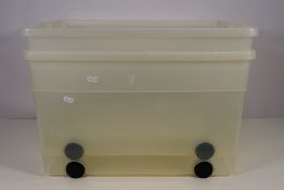 Plastic storage boxes x 2 - used condition, on wheels with hinged lids, approx 57 x 37 x 33 cm.