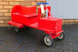 A vintage wooden scratch built train.