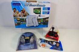 A boxed Lexibook TV Game Console, a Commodore 64 30 games in one joystick,