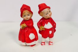 A pair of early 20th century German bisque nodder dolls approx 10cm (sg)