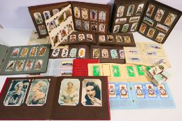 A good collection of cigarette and tea cards, predominantly housed in albums,
