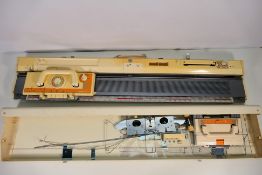 A Brother knitting machine, model KH840, contained in carry case.