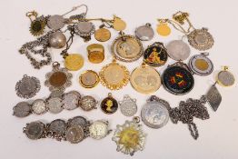 A collection of coins mounted as pendants, rings, bracelets and similar.