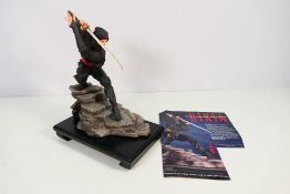 A Franklin Mint porcelain figure designed by Sum Nakamura, Ninja, with wooden display plinth,