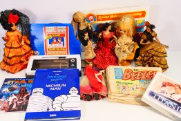 Lot to include comics, Star Wars Scrapbook, costume dolls and other.