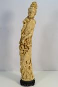 A large Asian faux ivory figure,