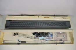 A Brother KH836 knitting machine contained in carry case.