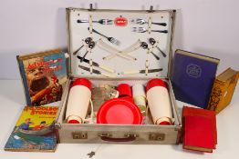 An Isovac picnic set contained in case and a quantity of publications to include Alice In