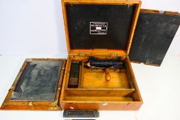 An antique Gestetner Neo Cyclostyle duplicating machine in fitted oak case.