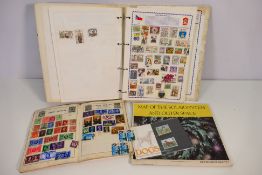 A collection of GB and foreign stamps housed in two albums and some loose and a map of the solar