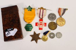 A small quantity of medals and coins to include a 1939-1945 Star.