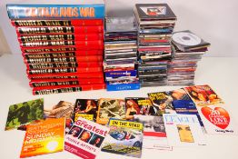 A collection of compact discs and a quantity of military related publications. [2].