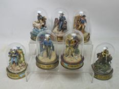 John Wayne - Seven limited edition hand painted TFM/Franklin Mint sculptures under glass domes,