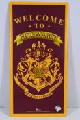 Harry Potter - A metal Welcome To Hogwarts sign, 60 cm x 30 cm.