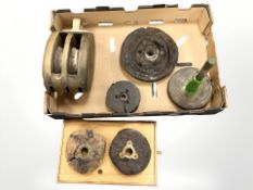 A large wooden ship's block, further antique pulley wheels, etc.