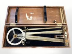 An American 3-arm right-handed ship's protractor, in teak case measuring 59cm wide.
