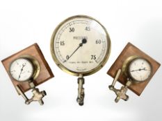 A brass-cased pressure gauge measuring 0-75 ppsi, marked Made in England, length 42cm,