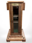 A homemade teak ship's style drinks cabinet in the form of a binnacle stand,