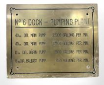 A brass rectangular plaque marked No. 6 Dock - Pumping Plant, 38cm by 31cm.