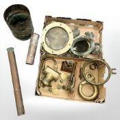 A collection of salvaged ship parts and components, including portholes,