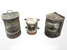 A small copper-cased ship's masthead lamp, and two further larger lamps, tallest 27cm.